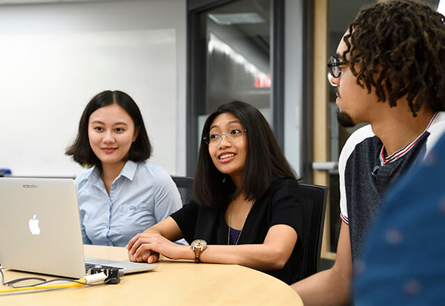 students looking at a computer