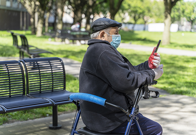 A senior man on a walker. 