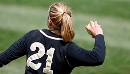 Girl throwing a softball